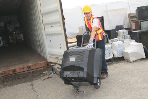Professional builders waste clearance team at work in Neasden